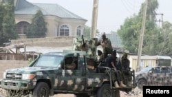 FILE - Nigerian military secure an area in Maiduguri, Nigeria, Feb. 16, 2019.