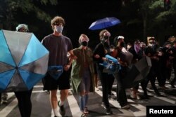 Demonstrators protest near the Charlotte Convention Center, the site of the Republican National Convention, in Charlotte, North Carolina, U.S. August 23, 2020. REUTERS/Leah Millis