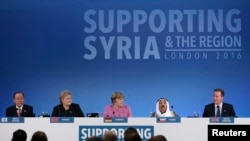 United Nations Secretary-General Ban Ki-moon, Norway's Prime Minister Erna Solberg, German Chancellor Angela Merkel, and the Emir of Kuwait, Sheikh Sabah al-Ahmad al-Sabah (L-R) listen as Britain's Prime Minister David Cameron speaks at the donors Confere