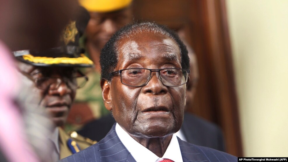 Zimbabwean President Robert Mugabe is seen upon arrival for his annual State of the Nation address at Parliament in Harare, Tuesday, Dec. 6, 2016. 