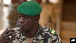 FILE - Capt. Amadou Haya Sanogo addresses the press at junta headquarters in Kati, outside Bamako, Mali, March 30, 2012. 