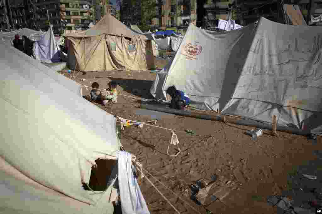 Children play around protest camp tents in Tahrir Square, Cairo, Egypt, December 12, 2012. 