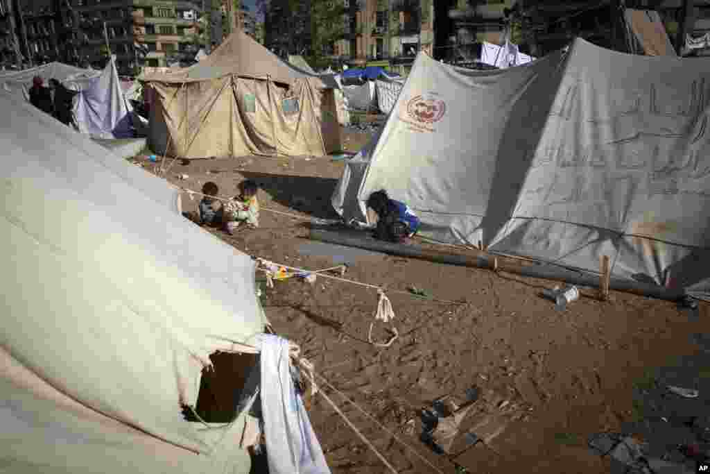 Children play around protest camp tents in Tahrir Square, Cairo, Egypt, December 12, 2012.