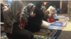 Uighur Muslim women pray as part of Eid festivities in Falls Church, Virginia, Aug. 21, 2018. (B. Gallo/VOA) 
