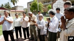 Survivors from Khmer Rouge's main prison and regime victims gather together to greet the officials of war crime tribunal in a former Khmer Rouge S-21 prison, known as Tuol Sleng, now a genocide museum, in Phnom Penh, file photo. 