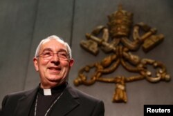 Archbishop Angelo De Donatis, Vicar General of Rome, presents a Pope Francis' document, known as an apostolic exhortation, entitled "Gaudete et exsultate" (Rejoice and be glad), at the Vatican, April 9, 2018.