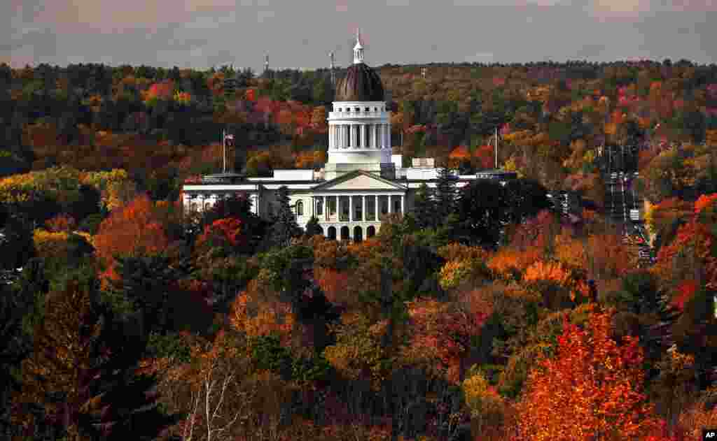 The State House is surrounded by fall foliage in Augusta, Maine, Oct. 23, 2017.