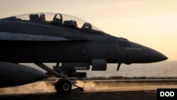 An F/A-18F Super Hornet launches from the flight deck of the aircraft carrier USS Theodore Roosevelt which is supporting strike operations in Iraq and Syria, on Oct. 10, 2015.