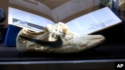 This image taken from video shows the Nike handmade Moon Shoe, designed by Nike co-founder Bill Bowerman in 1972. (AP Photo/Ted Shaffrey)
