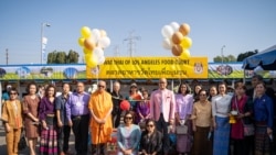 People take a group picture during the reopening ceremony of the Wat Thai (Thai Temple) of Los Angeles Food Court following the outbreak of the coronavirus disease (COVID-19) in North Hollywood, Los Angeles, CA, November 06, 2021.