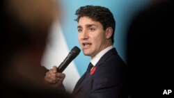 Canadian Prime Minister Justin Trudeau speaks at the Paris Peace Forum as part of the commemoration ceremony for Armistice Day, in Paris, Nov. 11, 2018. 