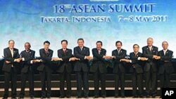 Heads of states and governments of the Association of Southeast Asia Nations pose for a group shot during the opening ceremony of the 18th ASEAN Summit in Jakarta, Indonesia, May 7, 2011.