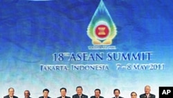 Heads of states and governments of the Association of Southeast Asia Nations pose for a group shot during the opening ceremony of the 18th ASEAN Summit in Jakarta, Indonesia, May 7, 2011.