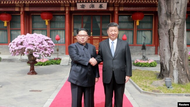 中国领导人习近平在北京会见朝鲜领导人金正恩(2018年3月路透社)
