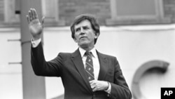 FILE - Then-Democratic presidential hopeful, U.S. Senator Gary Hart, waves goodbye, to a crowd of supporters in Springfield, Illinois, March 15, 1984. In 1988, Hart was considered a front-runner for the Democratic presidential nomination but a report alleging that he had an affair with model Donna Rice brought him down.