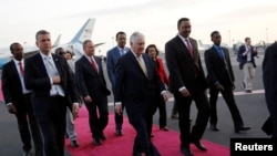 Ethiopia's Minister of Foreign Affairs Workneh Gebeyehu (center R) walks the red carpet with U.S. Secretary of State Rex Tillerson as he arrives to begin a six-day trip in Africa, landing at Addis Ababa International Airport in Addis Ababa, March 7, 2018.