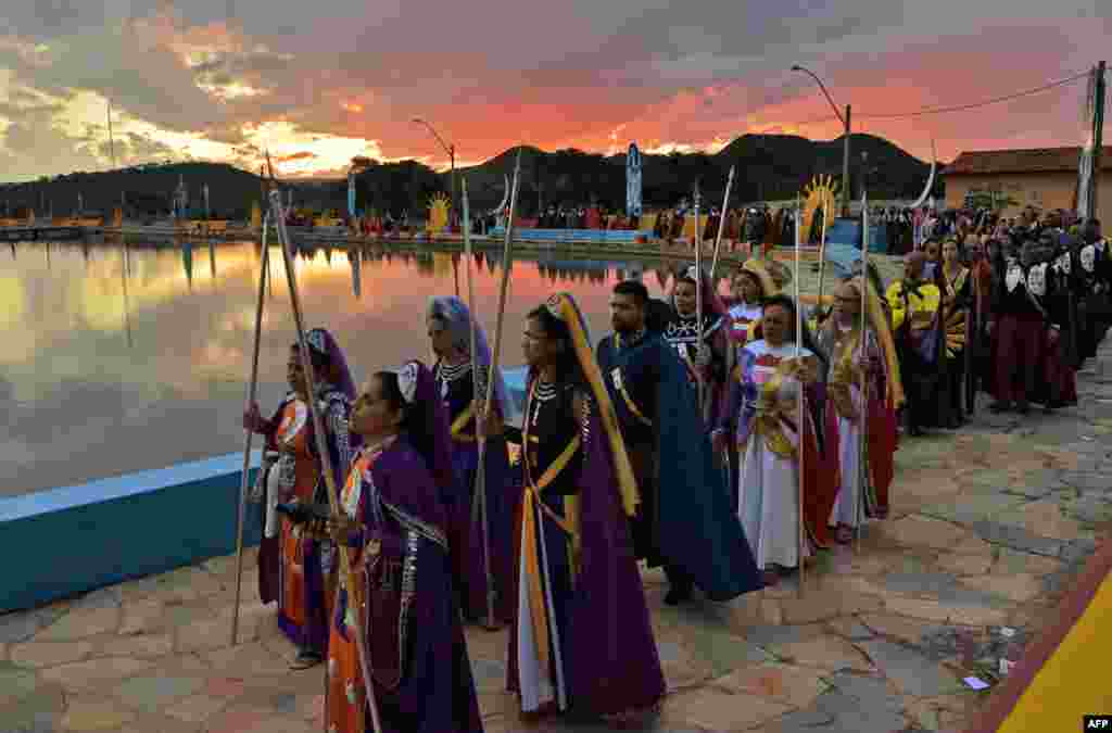 Devotees of the Vale do Amanhecer religious community take part in a ceremony at their temple complex in Vale do Amanhecer (Sunrise Valley) on the outskirts of Planaltina, 50 km from the Brazilian capital, Brasilia, April 30, 2019.