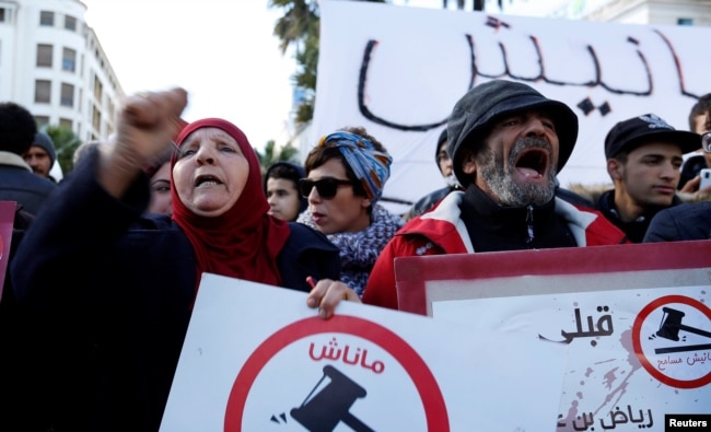 Protesters shout slogans against rising prices and tax increases in Tunis, Tunisia, Jan. 13, 2018.
