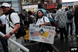 Pope Francis supporters gather outside of Madison Square Garden as he celebrates Mass on Sept. 25, 2015 in New York City.