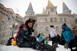 Children play in the yard of a kindergarten at Lenin state farm, outside Moscow, Russia, Jan. 26, 2018.