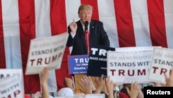 Republican presidential candidate Donald Trump speaks at a campaign rally at Werner Enterprises Hangar in Omaha, Nebraska, May 6, 2016. 