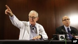 Dr. Edward Goodman, left, and Dr. Mark Lester at Texas Health Presbyterian Hospital Dallas, answer questions about an Ebola infected patient under their care, Sept. 30, 2014. (AP Photo/LM Otero)