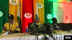 Zimbabwe Electoral Commission head Priscilla Chigumba speaks to reporters and observers in Harare flanked by deputy Joyce Kazembe and her chief officer Utoile Silaigwana, July 30, 2018. She said two presidential candidates had violated electoral laws by c