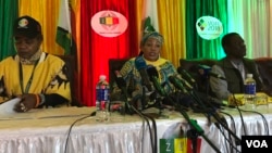Zimbabwe Electoral Commission head Priscilla Chigumba speaks to reporters and observers in Harare flanked by deputy Joyce Kazembe and her chief officer Utoile Silaigwana, July 30, 2018. She said two presidential candidates had violated electoral laws by c
