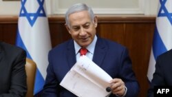 Israeli Prime Minister Benjamin Netanyahu at the start of the weekly cabinet meeting at his Jerusalem office, May 12, 2019.