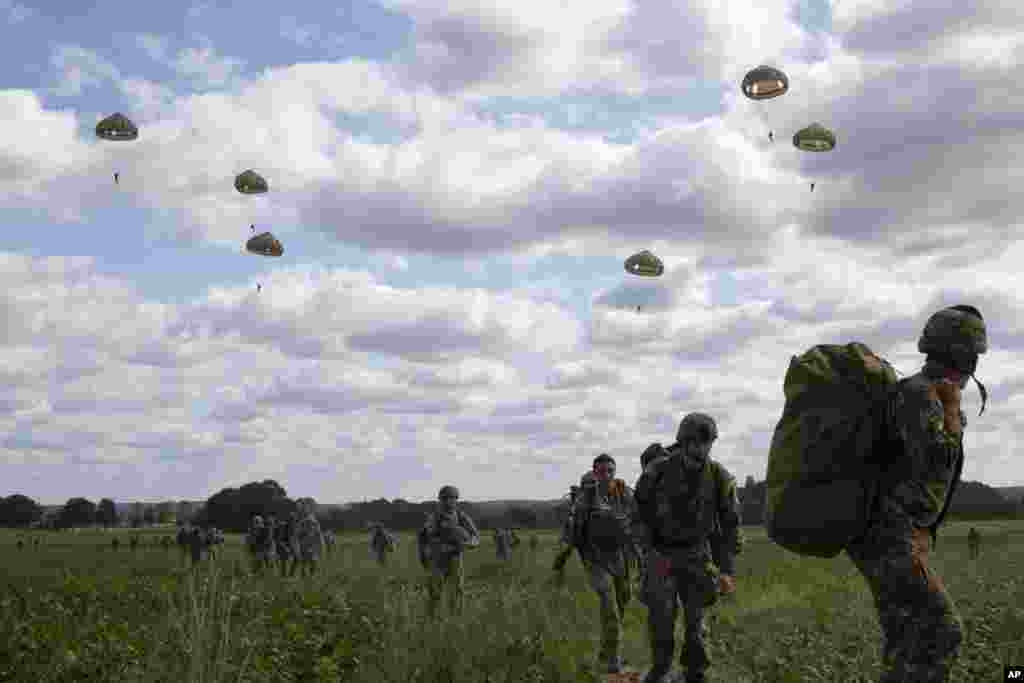 Parachutists jump from a plane near Groesbeek, Netherlands as part of commemorations marking the 75th anniversary of Operation Market Garden, an ultimately unsuccessful airborne and land offensive that Allied leaders hoped would bring a swift end to World War II.