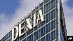 The logo of Belgian-French financial services group Dexia is seen on their building in the business district of La Defense, near Paris, October 7, 2011.