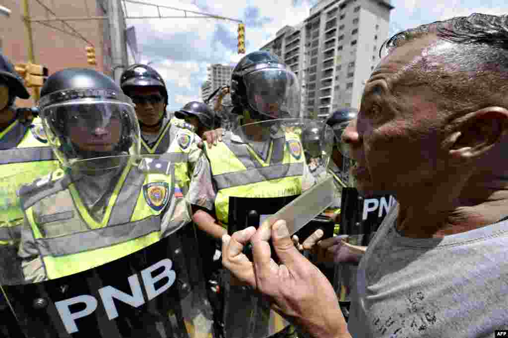 Venezuelan opposition activists march in Caracas, demanding the government set the date for a recall referendum against President Nicolas Maduro.