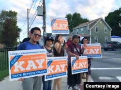 Supporters of the Republican candidate Kamara Kay recently holding campaign signs.