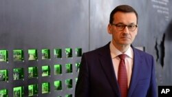 Polish Prime Minister Mateusz Morawiecki visits the Ulma Family Museum of Poles Who Saved Jews during WWII, in Markowa, Poland, Feb. 2, 2018.