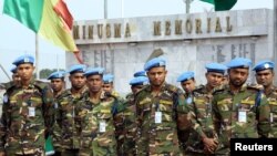 FILE - U.N. peacekeepers attend a memorial ceremony for their comrades at the MINUSMA base in Bamako, Mali, Sept. 27, 2017. Four peacekeepers were killed Wednesday in Mali when their vehicle ran over a mine.