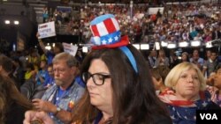 Delegates sport their hats at the DNC in Philadelphia (Photo: S. Barua/VOA)