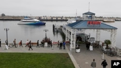 Commuters board a ferry to San Francisco Oct. 21, 2013, from Jack London Square in Oakland, California.