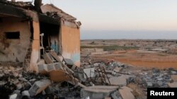 A general view shows a damaged school that was targeted on Monday by what activists said were U.S.-led air strikes, at Ain al-Arous town in Raqqa governorate, October 1, 2014.