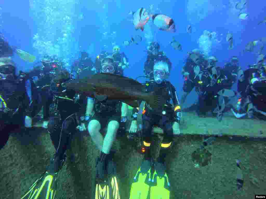 Ray Woolley, diver and World War II veteran, is seen underwater during an attempt to break a new diving record as he turns 96 by taking the plunge at the Zenobia, a cargo ship wreck off the Cypriot town of Larnaca, Cyprus, Aug. 31, 2019.