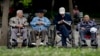 资料照 - 几位坐在轮椅上的年迈老人正在北京一座公园里休息。
