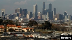 FILE - A housing development area is seen with the Melbourne, Australia, skyline in the distance, June 2, 2010. 