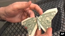 Origami artist Robert Lang leaves a special tip at a restaurant