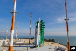 The Nuri rocket, the first domestically produced space rocket, sits on its launch pad at the Naro Space Center in Goheung, South Korea, Thursday, Oct. 21, 2021. (Korea Pool via AP)