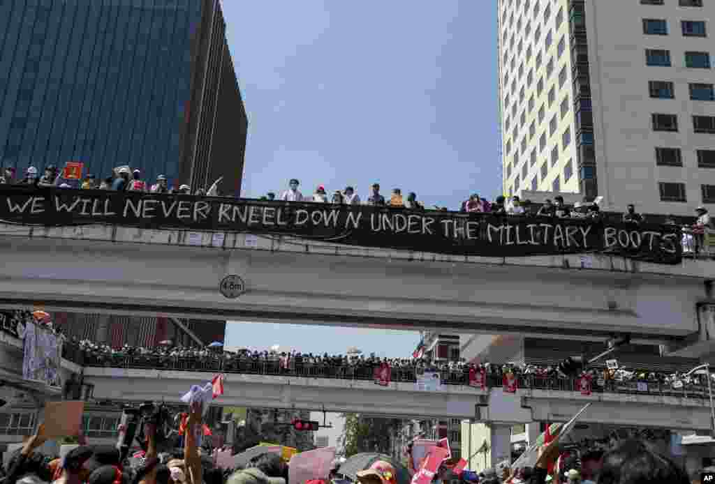 Demonstrators gather in an intersection near the Sule Pagoda to protest against the military coup in Yangon, Myanmar.