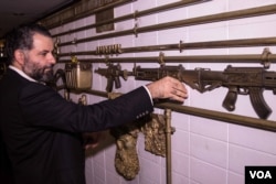 Michel Elefteraides’ decor incorporates elements of violence - here guns are form part of the tubing on the walls of Nowheristan’s headquarters, Beirut, Sept. 5, 2016. (Photo: J. Owens/VOA)