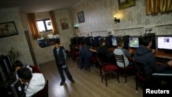 FILE - People use computers at an internet cafe in Ankara, April 6, 2015. The website of Russia's news agency Sputnik has been blocked in Turkey, in another indication of strained relations between the two countries.