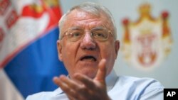 FILE - Serbia's extreme nationalist leader Vojislav Seselj speaks during a press conference in Belgrade, Serbia, Dec. 7, 2017.