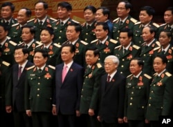 Vietnamese President Truong Tan Sang, front row left, Prime Minister Nguyen Tan Dung, front row third left, and Communist Party General Secretary Nguyen Phu Trong, front row third right, pose for a group photo with the Army generals after the election for