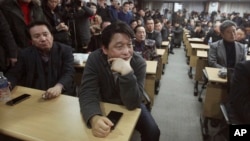 South Korean owners who run factories in the suspended inter-Korean Kaesong Industrial Complex, attend an emergency meeting held by the council of South Korean companies operating in the industrial park, in Seoul, South Korea, Friday, Feb. 12, 2016.