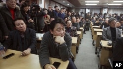 South Korean owners who run factories in the Kaesong Industrial Complex, attend an emergency meeting held by the council of South Korean companies operating in the industrial park, in Seoul, South Korea, Friday, Feb. 12, 2016.